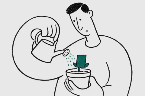 waist-up view of a man with a short side parting watering a single business card planted in a flowerpot until it sprouts tiny leaves; hopeful