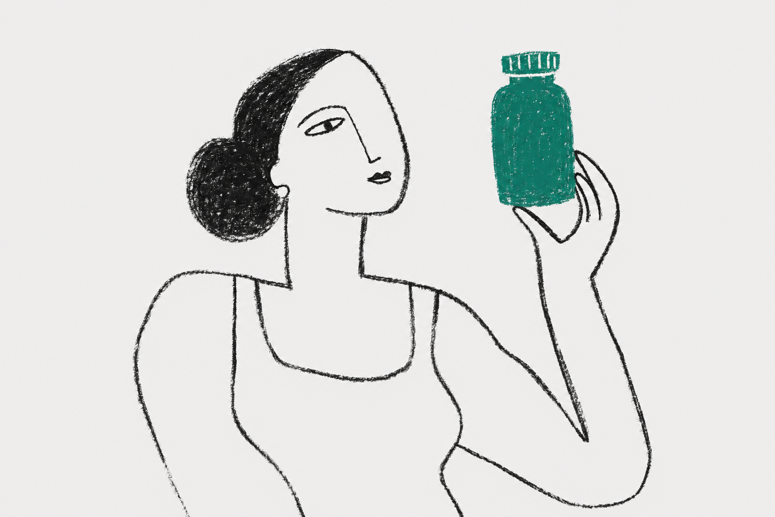 woman holding supplement bottle