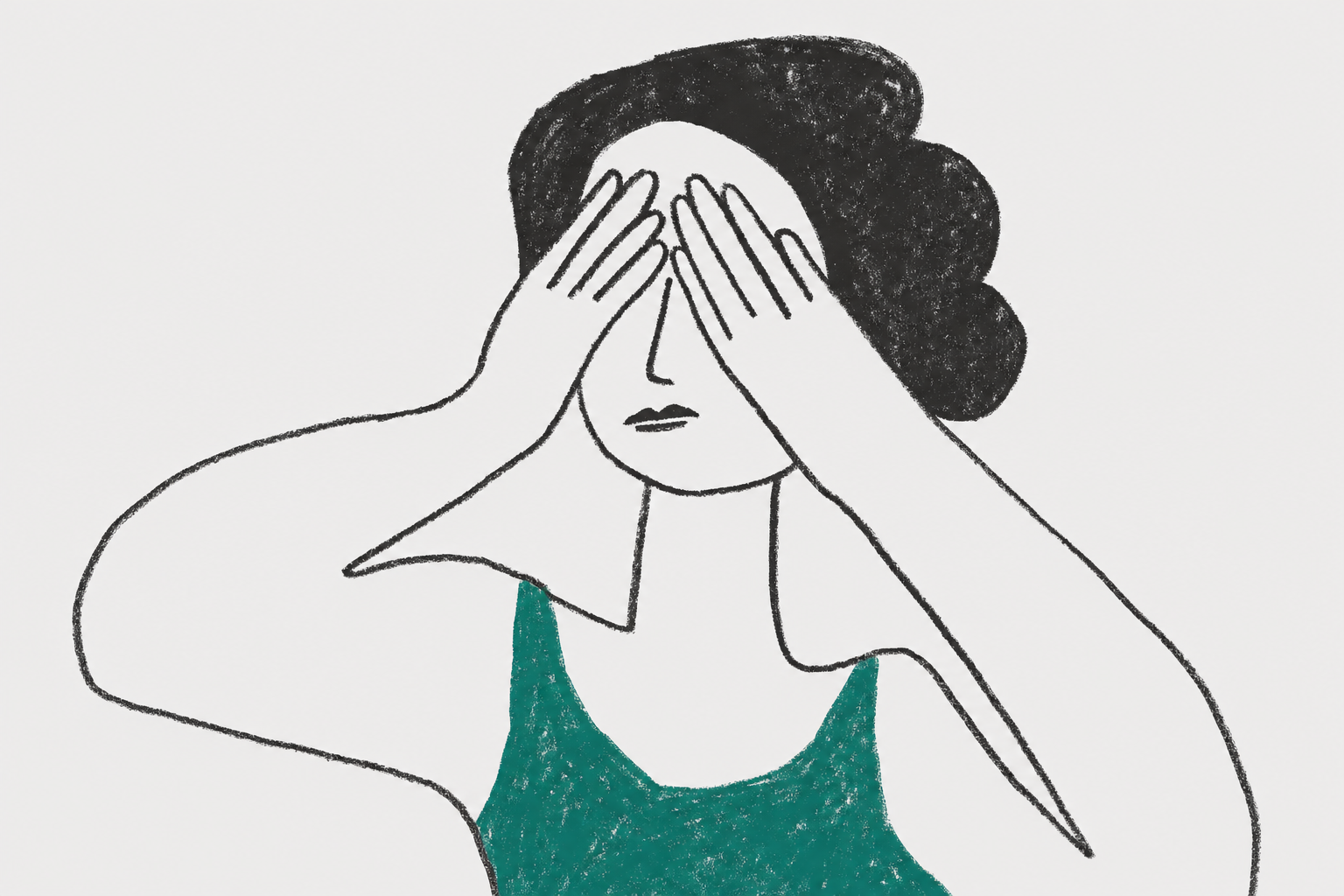 woman covering her eyes with hands